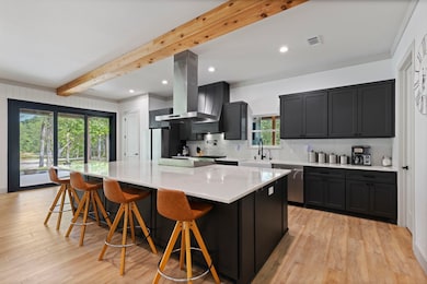 The kitchen flows seamlessly into the living space