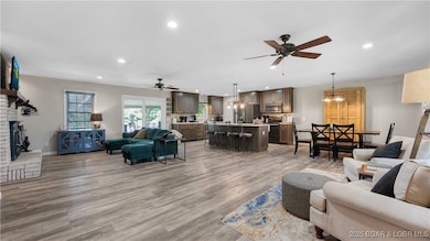 Spacious open living room and kitchen with newer L