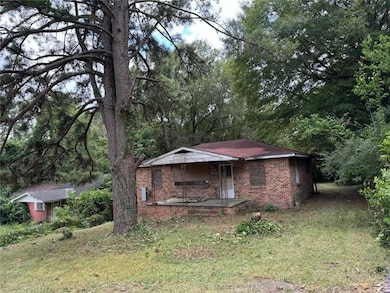 View of outbuilding featuring a porch