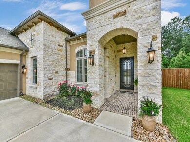 Covered stone entry with brick paver floor.