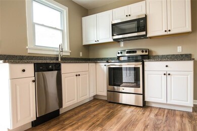 Newly remodeled kitchen featuring painted white ca