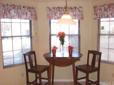 BRIGHT, CHEERY KITCHEN HAS WINDOWED BREAKFAST NOOK
