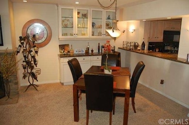 Dining area off living room. Custom built in grani