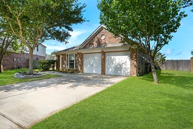Long Double Driveway offers extra Parking to the 2 car garage. Both sides offer space between neighboring homes.