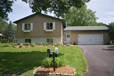 New asphalt driveway, landscaped with large fenced