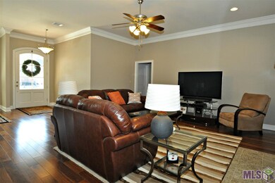 Spacious living room with beautiful wood floors.