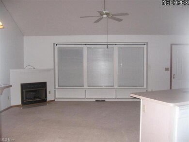 Roomy living room with vaulted ceiling, gas firepl