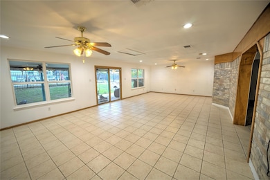 Unfurnished room with a ceiling fan, recessed lighting, and light tile patterned flooring