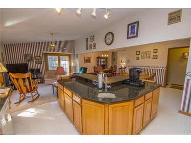 Kitchen with granite counters open to family room