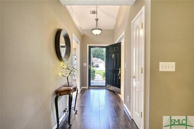 light and bright entry way with office on the left