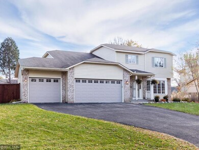 3 car garage with wide driveway.