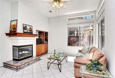 Family room with a fireplace and media niche