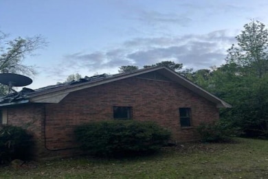 View of side of home with brick siding