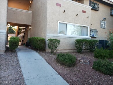 View of home's exterior featuring stairway and stucco siding