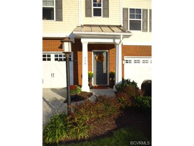 Inviting entry with covered front porch and concre