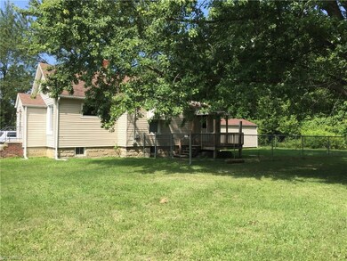 side view showing fenced in yard