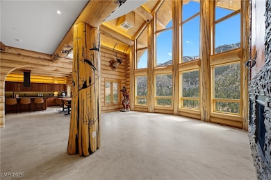 Great room, grand picture window with mountain vie