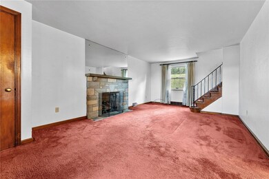 An inviting living room with plenty of furniture s