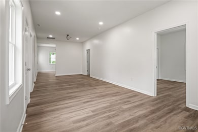 Living room with recessed lighting and wood finish