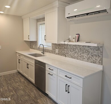 2103 4th St NE, Jamestown, ND 58401 - photo 2