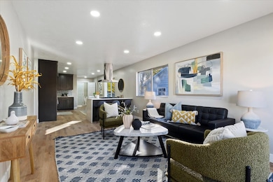 Living room featuring light wood-style floors and recessed lighting