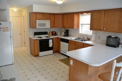 oak cabinetry and breakfast bar