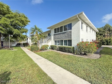 View of front of house with stucco siding and a fr