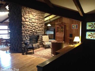 Centrally located fireplace also has indoor grill.