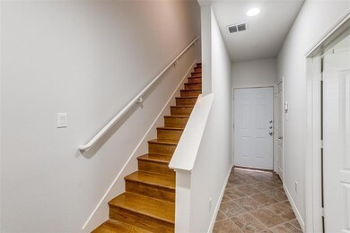 Upon entering, beautiful tile leads to a coat clos