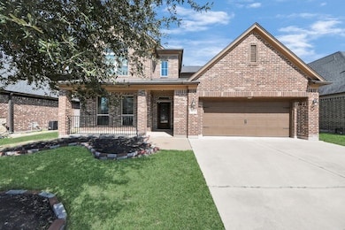This charming brick home features a two-car garage