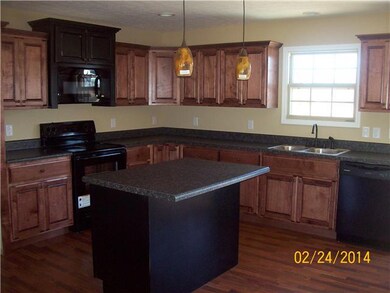 Custom cabinets in a spacious kitchen w/ walk in pantry