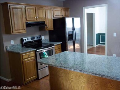 Kitchen. Kitchen has nearly new stainless steel appliances,new hardwood floors, and brand new Granite Countertops!