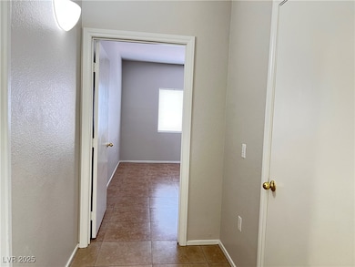 Hall featuring baseboards