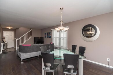 Open feel. Coat closet to the left of sofa.