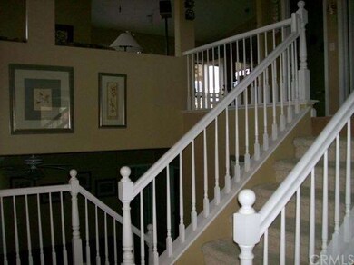 At entry, up to living area/ down to game room