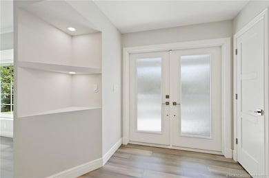 Front Foyer Entrance adjacent to Coat Closet, Powd