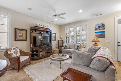 Living area with light tile patterned floors, a ce