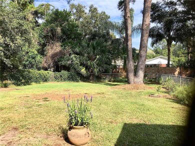 Backyard view from patio.  Large enough for a pool