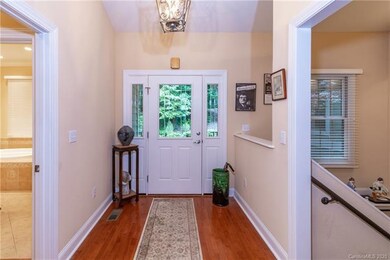 Formal entry with hardwood floors