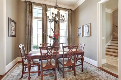 Separate dining room with wood flooring and great