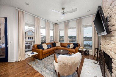 Living room with a ceiling fan, wood finished floo