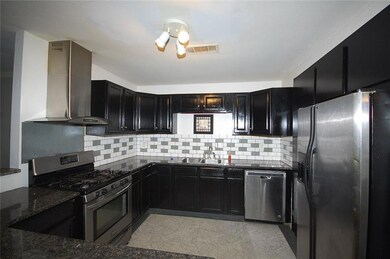 Granite counter tops, gas cook top, subway tile ba