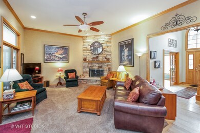 Living room has natural, wood burning, stone firep