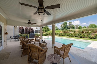 Enjoy pool life on this large patio