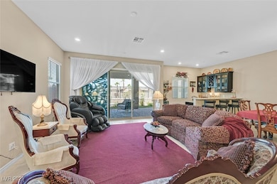 Living room featuring tile patterned flooring, ple