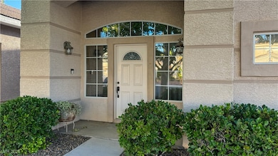 Entrance to property with stucco siding