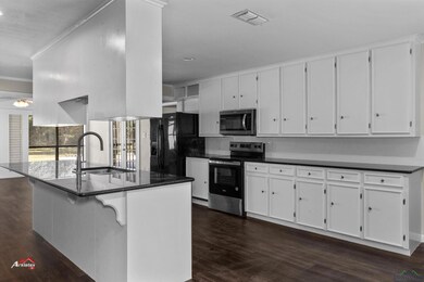 Kitchen with appliances with stainless steel finis