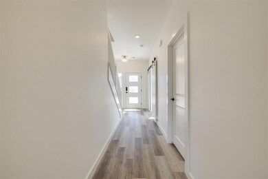 View of entryway. Door on the right is to the laundry room.