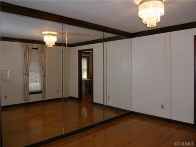 Living Room: Hardwood Floor, Crown Molding, Chande
