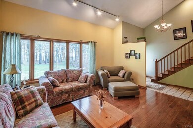 Spacious foyer with ceramic tile entry.   living r